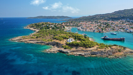Naklejka na ściany i meble Aerial drone bird's eye view photo of picturesque neoclassic houses in historic and traditional island of Spetses with emerald clear waters, Saronic Gulf, Greece