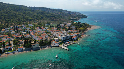 Aerial drone photo of secluded beaches in Ligoneri area near old town of Spetses island, Saronic gulf, Greece