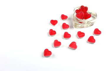 Heart shaped candy sweets in heart shape with heart shaped glass container