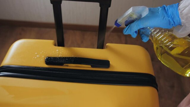 Sanitizing the suitcase. The opening of borders after the quarantine. Prevent infection by treating the suitcase with a disinfectant.