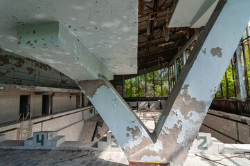 Azure Swimming Pool in Pripyat, Chernobyl exclusion Zone. Chernobyl Nuclear Power Plant Zone of...