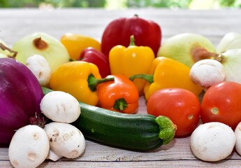 Fresh organic summer harvested vegetables washed and ready for preparing healthy meals and side dishes to share as a family
