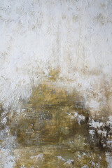 gray-yellow old wall with layers of paint. Concrete texture on the background. Oil paint on canvas