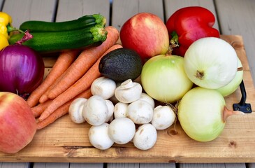 Fresh organic summer harvested vegetables washed and ready for preparing healthy meals and side dishes to share as a family
