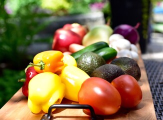 Fresh organic summer harvested vegetables washed and ready for preparing healthy meals and side dishes to share as a family