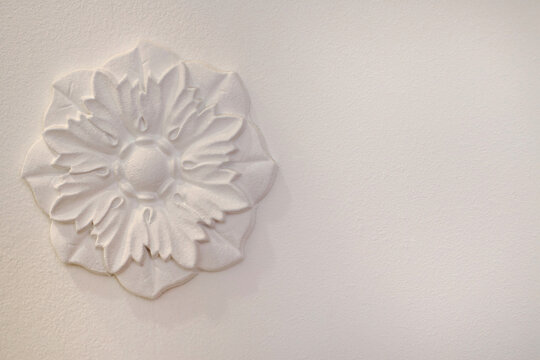 decorative moulding on a white wall, horizontal photo, place for text, vintage interior