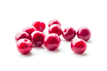 daylight. red cherry on a white background. Berry rash and looks at us