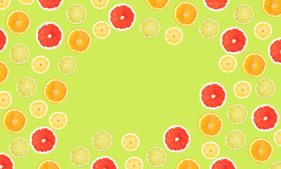 Bright banner with slices of citrus lemon, lime, orange and grapefruit on a light green background with space for text in the center. Advertising.