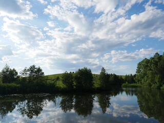 Fototapeta na wymiar blue sky with trees and river