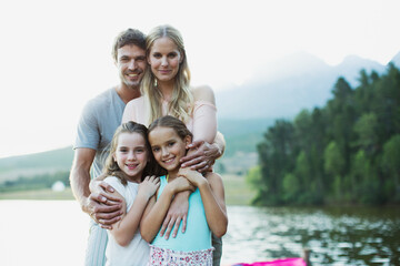 Fototapeta na wymiar Smiling family at lakeside