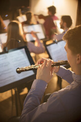 Oboist performing in orchestra © Tom Merton/KOTO