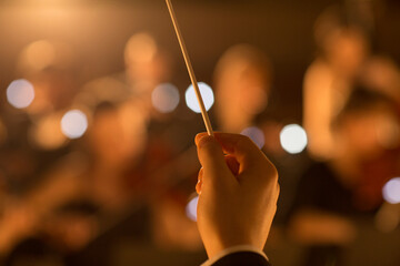 Close up of orchestra conductor holding baton