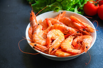 shrimp cooked seafood ready to eat prawn Menu serving size. food background top view copy space organic healthy eating raw pescatarian 