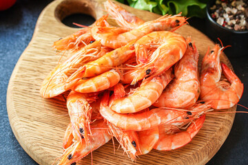 shrimp cooked seafood ready to eat prawn Menu serving size. food background top view copy space organic healthy eating raw pescatarian 