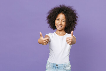 Blinking little african american kid girl 12-13 years old in white t-shirt isolated on pastel...