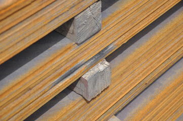 hot rolled steel plates with rust edges, wooden separation