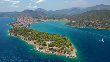 Fototapeta premium Aerial drone photo of picturesque city of Ermioni built in peninsula with forest of Bistis at the end, Argolida, Peloponnese, Greece