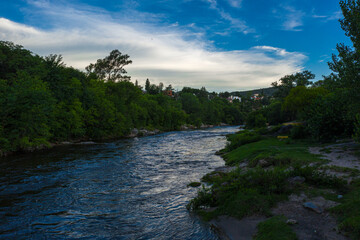 Fototapeta premium River flowing in the forest. Aerial view