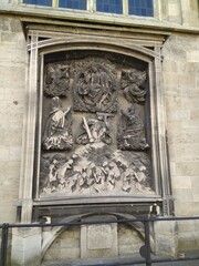 The bas-relief on the wall of the cathedral in Vienna in Austria.