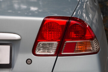 Close up of rear taillight on a grey vehicle