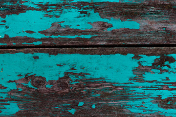 Old shabby wooden boards with cracked color paint, background