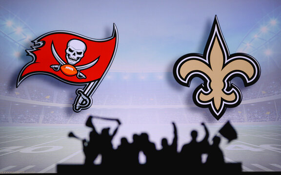 Tampa Bay Buccaneers vs. New Orleans Saints. Fans support on NFL Game. Silhouette of supporters, big screen with two rivals in background.