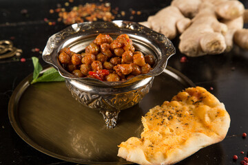 Beans and beans in a plate on a wooden table
