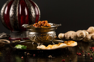 Beans and beans in a plate on a wooden table