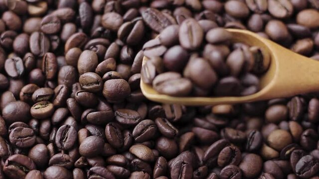 Coffee beans with a wooden spoon