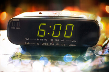 Black digital alarm radio clock.Alarm radio clock indicating time to wake up.Digital clock closeup...