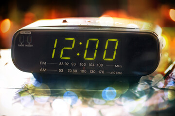 Black digital alarm radio clock.Alarm radio clock indicating time to wake up.Digital clock closeup...