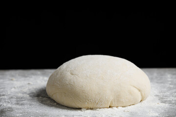 Fototapeta na wymiar Fresh dough ready for baking. Fresh dough on the kitchen table.