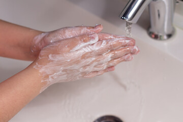 Fototapeta premium washing hands in the bathroom