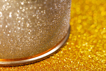 Silver jewelry close-up on gold glittering background