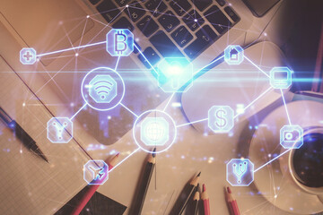 Social network hologram drawings over computer on the desktop background. Top view. Multi exposure. Concept of people connection.