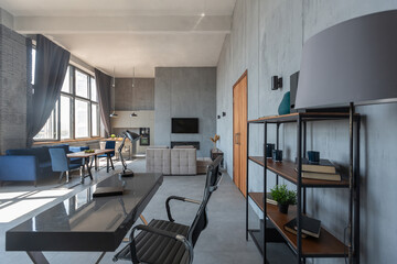 Modern minimalistic dark gray loft style studio apartment interior design. kitchen, sitting area, workplace, shower and bath. bright sun rays inside.