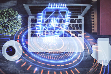 Multi exposure of data theme drawing hologram over topview work desk background with computer. Concept of technology.