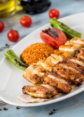 Turkish cuisine chicken wings grill. Grilled chicken wings on wooden background