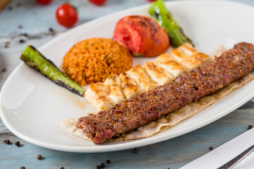 Turkish Adana Kebab with Vegetables on the Plate