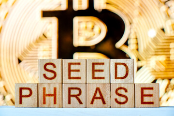 recovery phrase concept. wooden blocks with the phrase seed phrase with bitcoin on the background