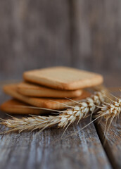 wheat ears on wooden background