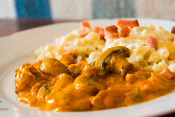 Paprika stew from chicken breast and mushroom and dumpling