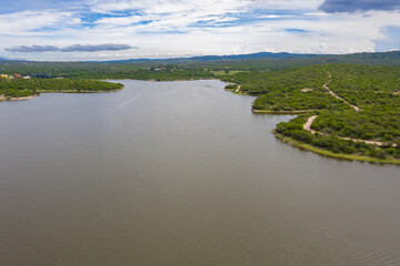 Aerial view of the lake and mountains with village below