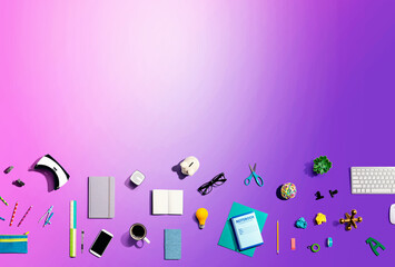 Collection of electronic gadgets and office supplies - flat lay