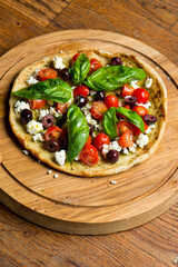 Pizza. Classic traditional Italian entrée favorite. New York Style Pizza with marinara sauce and topped with mozzarella cheese, meats and fresh vegetables. Baked in wood burning oven