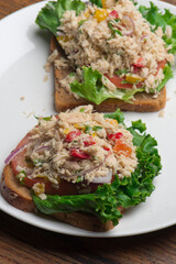 Tuna salad sandwich. Classic traditional American lunch menu item favorite, tuna fish sandwich. Albacore tuna, chopped celery, diced carrots, bell peppers, mayo, lemon juice and seasoned w/ s&P