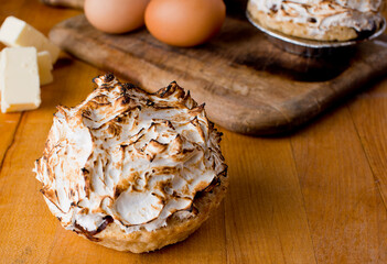 Baked Alaska Dessert. Classic American or French bakeries or pastry shop favorites. Cookies, whipped cream, cakes, chocolate syrup butter, eggs and vanilla beans.