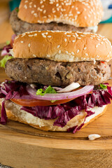 Hamburger made with lamb meat. Lamb burger. Classic traditional greek variation of the classic american burger tradition. seasoned lamb meat with feta cheese, red onion and greek mayo. 