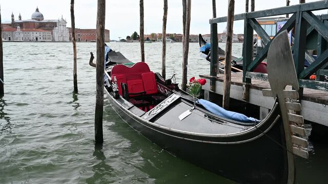 Venice, Italy - gondolas and gondoliers in the Grand Canal near the Rialto Bridge, in the San Marco Basin and between the canals of the lagoon city