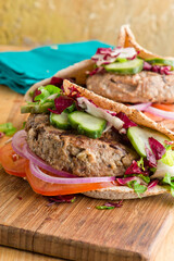 Hamburger made with lamb meat. Lamb burger. Classic traditional greek variation of the classic american burger tradition. seasoned lamb meat with feta cheese, red onion and greek mayo. 